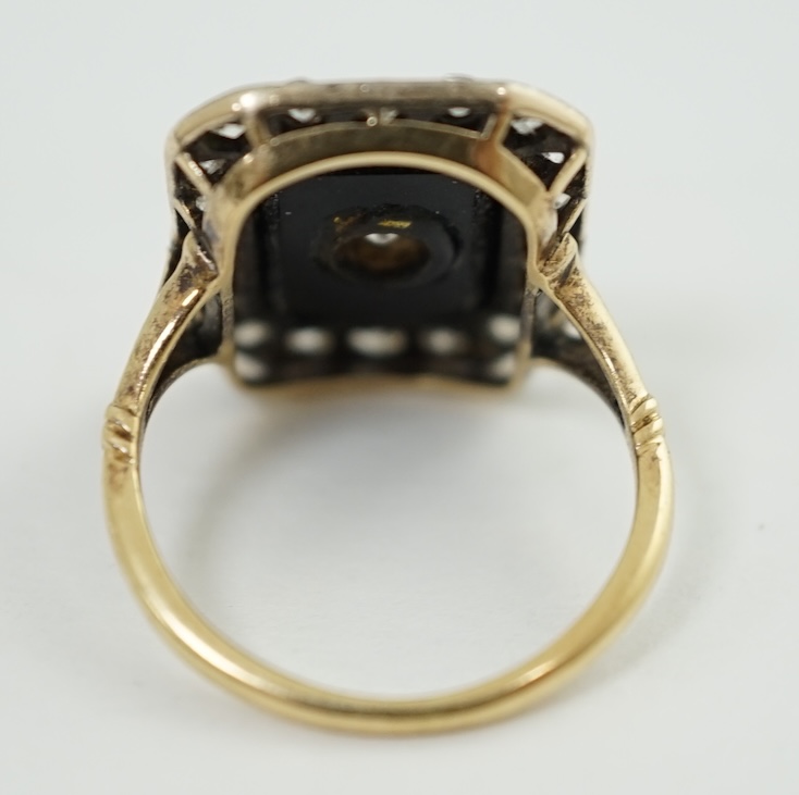 A 1940's? gold, black onyx and diamond cluster set tablet ring